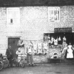 Photo showing G T Alcock, butchers in the 1900s. The boy on the left could be Edmund Astell