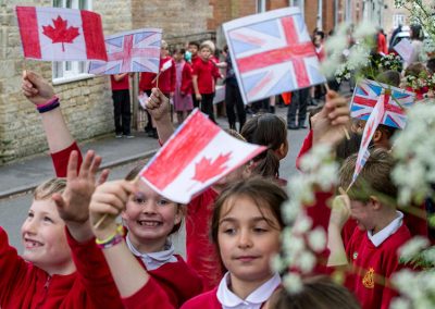 Union flags and Canadian flags being waved in Church Street