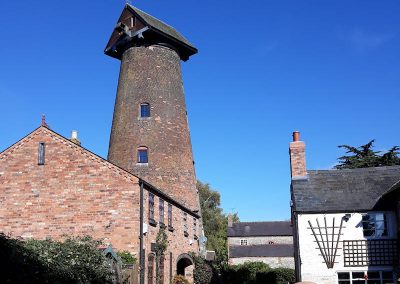Harbury Windmill against a clear blue sky, by Amanda Randall