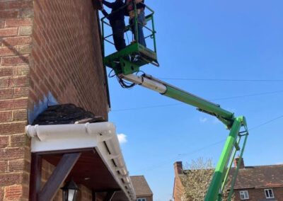 Chris Beaton and Richard Linforth in the cherry picker installing three swift boxes in Manor Road.